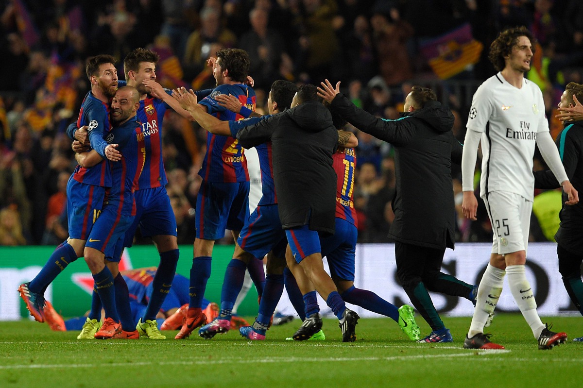 Barcelona players celebrate their victory during the UEFA Champions League round of 16 second leg football match FC Barcelona vs Paris Saint-Germain FC at the Camp Nou stadium in Barcelona on March 8, 2017. (AFP / LLUIS GENE)