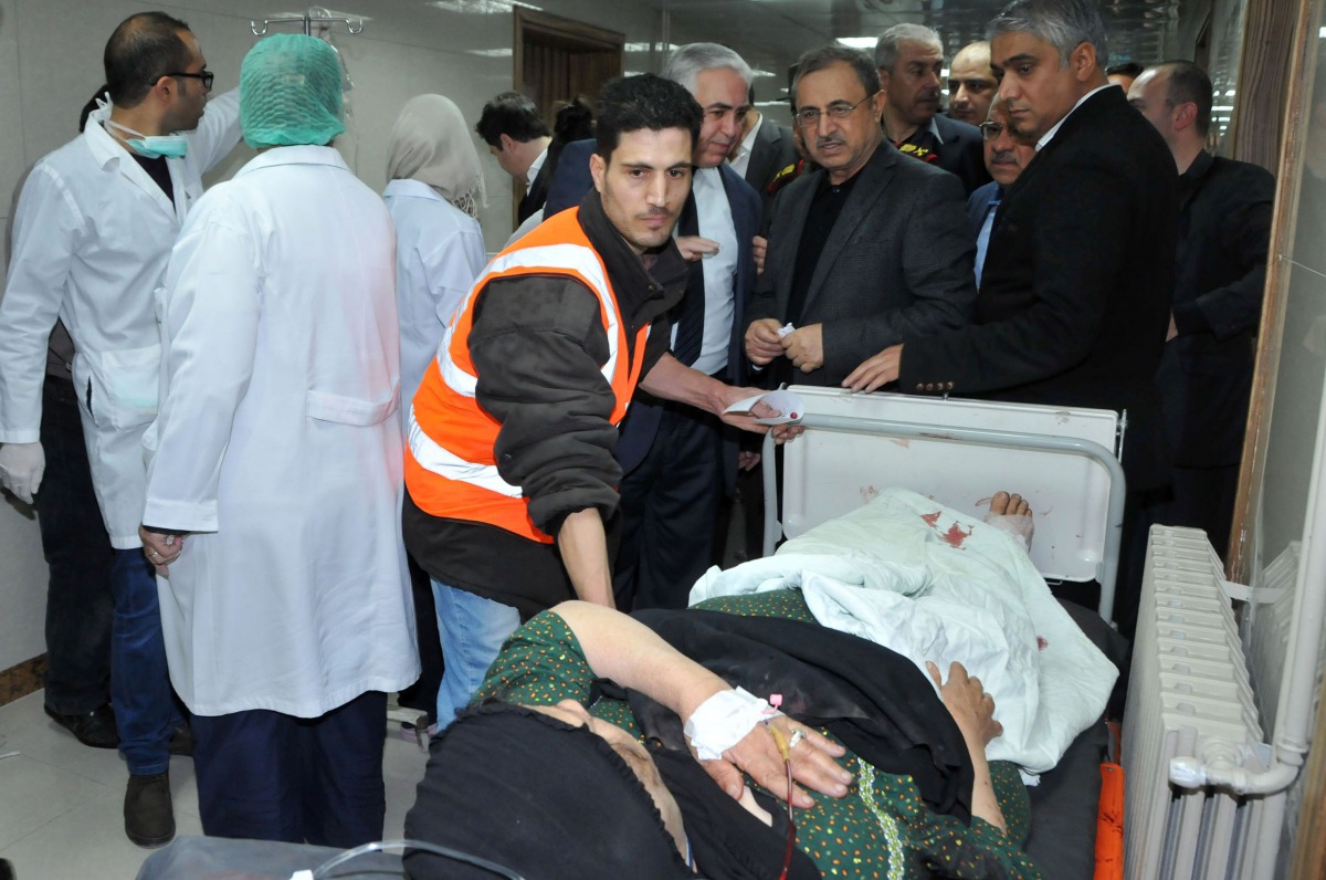 A handout picture released by the Syrian Arab News Agency (SANA) on March 11, 2017 shows a wounded man on stretcher at a hospital in the capital Damscus following a bomb attack.