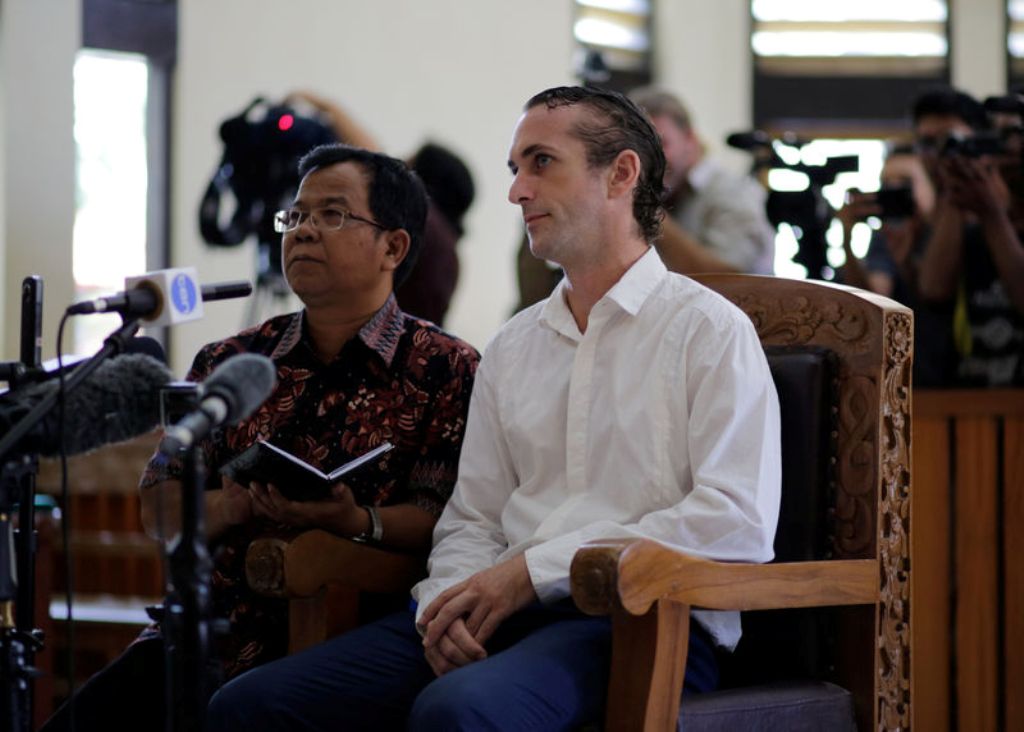 © Reuters. British national David Taylor sits in a courtroom with an interpretor during his sentencing over his role in the death of a police officer at the Denpasar District Court in Bali.