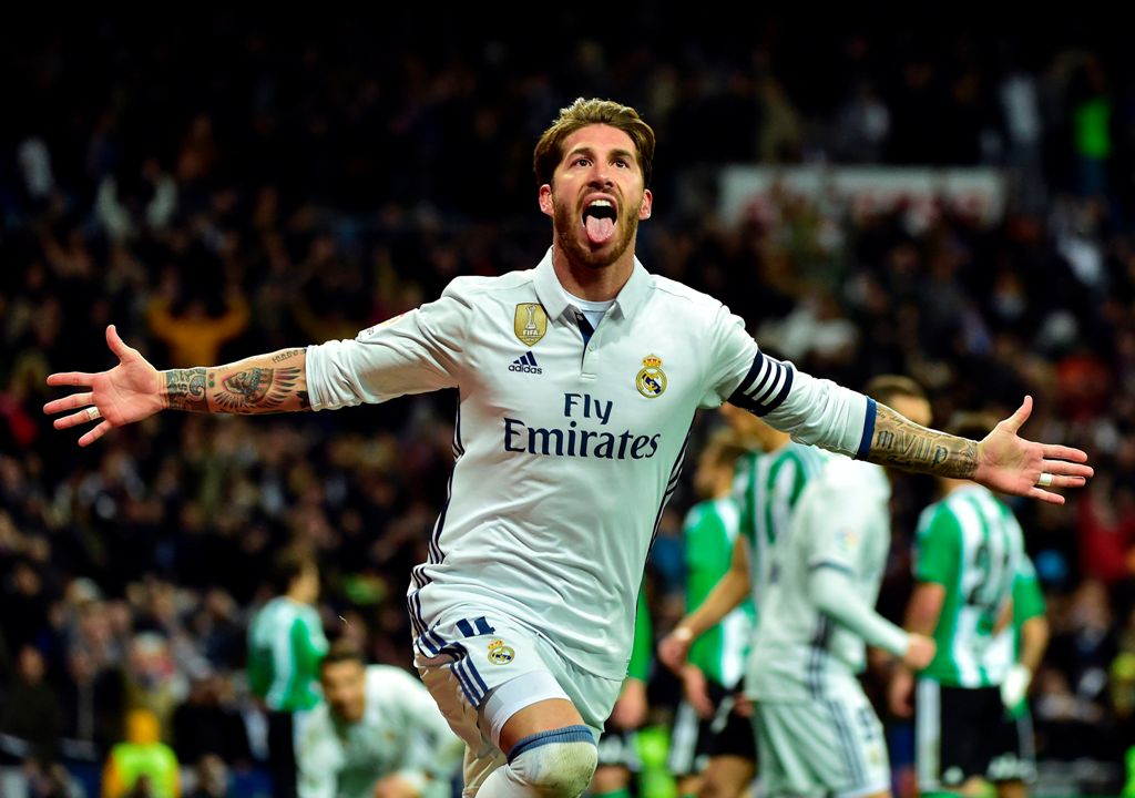 Real Madrid's defender Sergio Ramos celebrates after scoring a goal during the Spanish league footbal match Real Madrid CF vs Real Betis at the Santiago Bernabeu stadium in Madrid on March 12, 2017. / AFP / GERARD JULIEN
