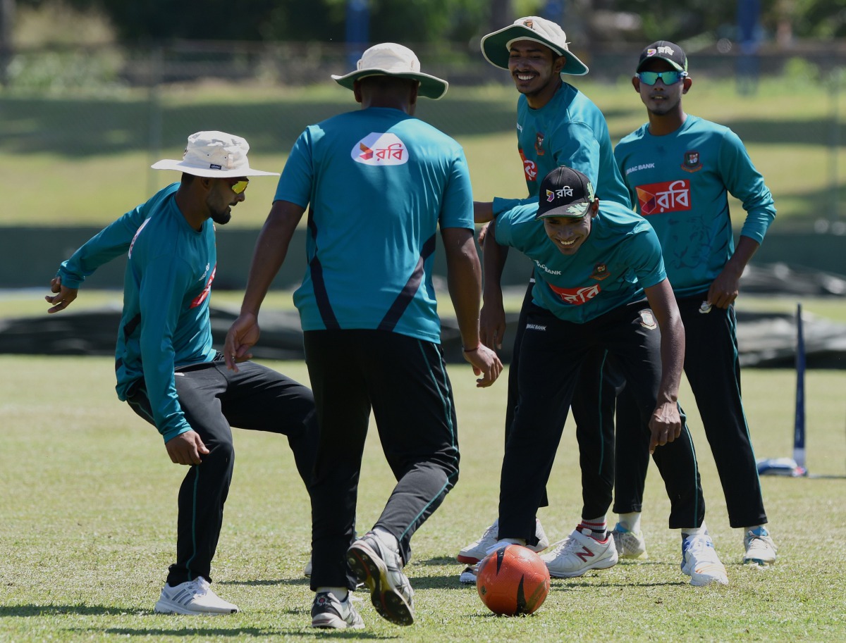 Bangladesh cricketers Soumya Sarkar (2R), Mehedi Hasan (C), Liton Das (L) and teammates play football during a practice session at The P. Sara Oval Cricket Stadium in Colombo on March 13, 2017. Bangladesh play their 100th Test on March 15, against Sri Lan