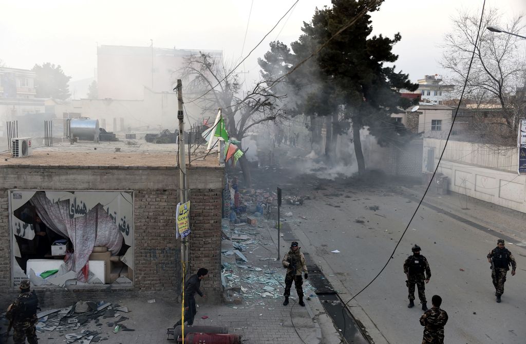 Afghan security personnel arrive at the site of an explosion in Kabul on March 13, 2017.   AFP / WAKIL KOHSAR
