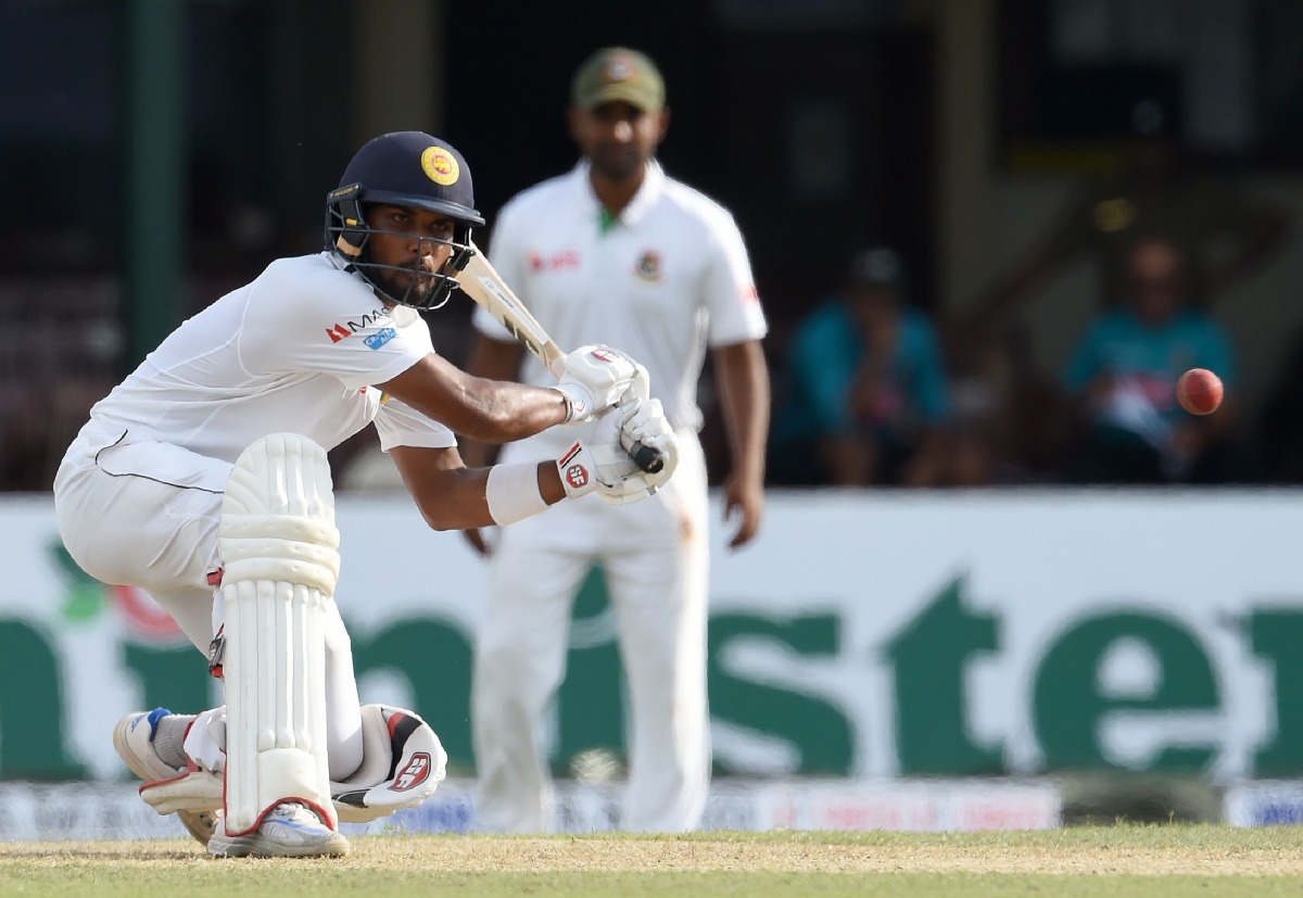 Sri Lankan cricketer Dinesh Chandimal watches the ball as he plays a shot during the first day of the second and final Test cricket match between Sri Lanka and Bangladesh at The P. Sara Oval Cricket Stadium in Colombo on March 15, 2017. (AFP / Ishara S. K