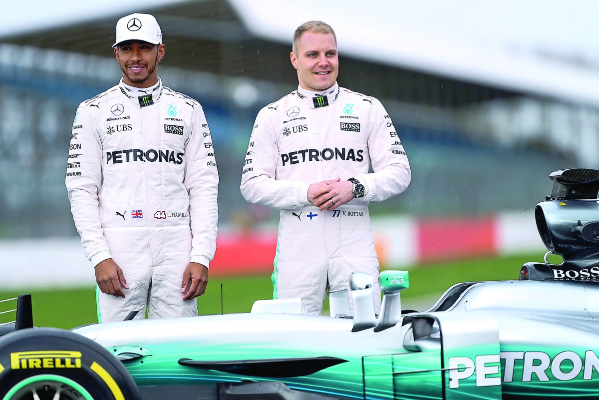  Lewis Hamilton (left) and Valtteri Bottas pose during the launch of new Mercedes F1 car in this last month's photo. Hamilton has given thumbs up to changes for 2017 season. 
