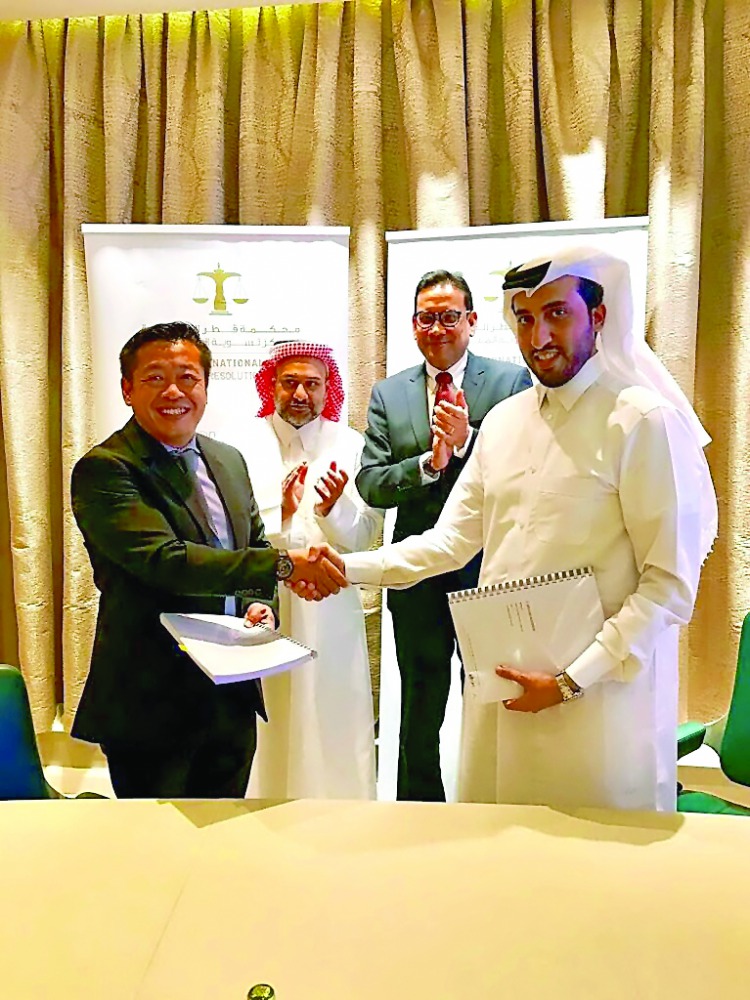 FROM RIGHT: QICDRC CEO Faisal Al Sahouti, Singapore's Ambassador to Qatar Jai Sohan Singh;  and QFC Authority  CEO Yousuf Al-Jaida.