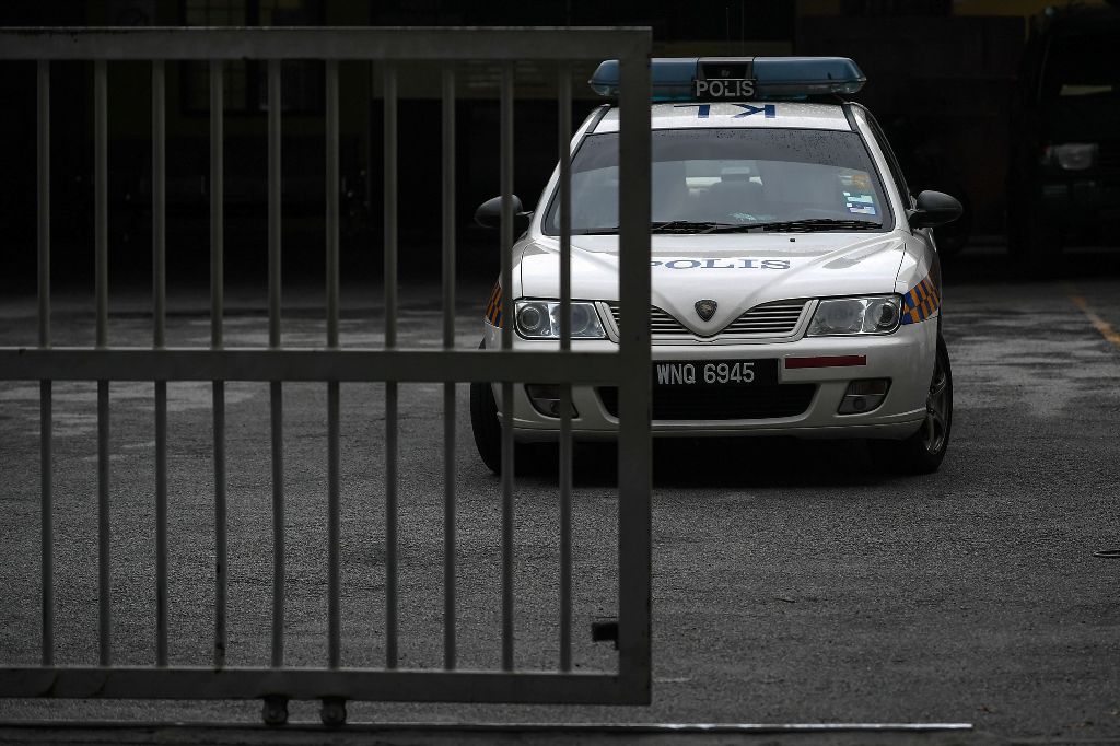 A Royal Malaysian Police vehicle is parked inside the forensics wing of the Hospital Kuala Lumpur, where the body of Kim Jong-Nam is being held, in Kuala Lumpur on March 19, 2017.   AFP / MOHD RASFAN
