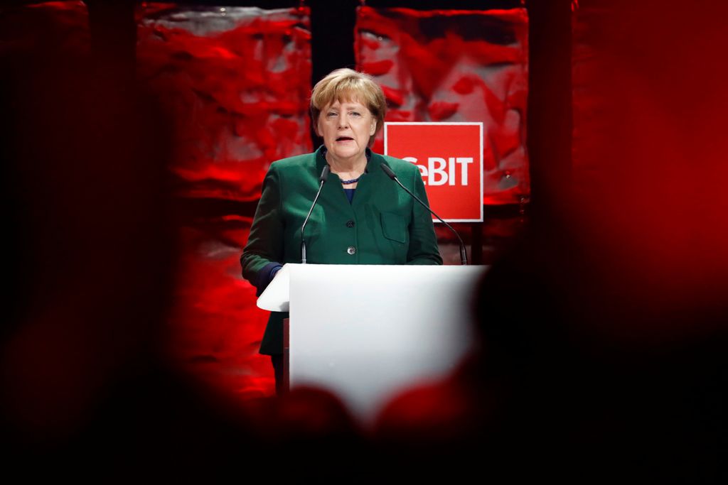 German Chancellor Angela Merkel leaves the stage after she delivered her speech at the official opening of the CeBIT technology fair in Hanover, central Germany, on March 19, 2017. AFP / Odd ANDERSEN
