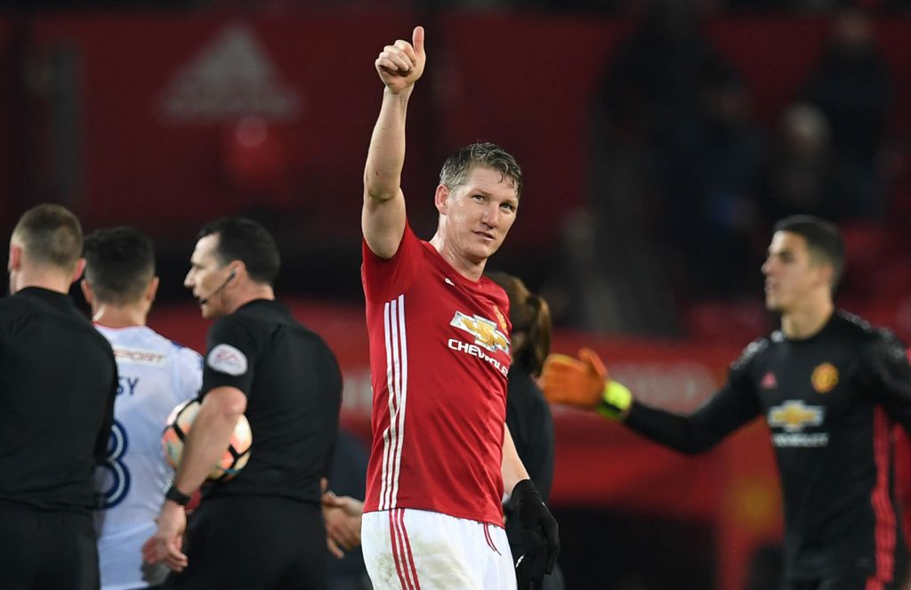 (FILES) This file photo taken on January 29, 2017 shows Manchester United's German midfielder Bastian Schweinsteiger (C) saluting the crowd at the end of the English FA Cup fourth round football match between Manchester United and Wigan Athletic at Old Tr
