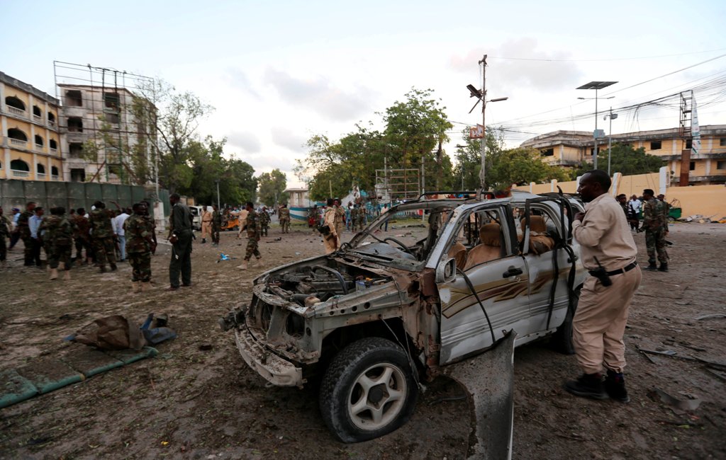 Somali security officers secure the scene of a suicide car explosion in front of the national theatre in Somalia's capital Mogadishu, March 21, 2017 REUTERS/Feisal Omar.