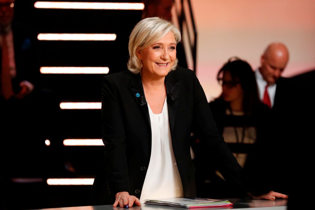 Far-right Front National (FN) party Marine Le Pen waits before taking part in a debate organised by the French private TV channel TF1, between five candidates for the French presidential election, on March 20, 2017 in Aubervilliers, outside Paris. / AFP /