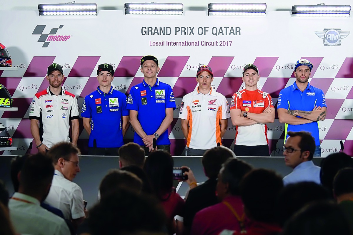 MotoGP riders pose for a photograph during a press conference held at Losail International Circuit yesterday. The riders will begin their hunt for the title when the new MotoGP season starts on Sunday at Qatar's iconic Losail International Circuit. 
