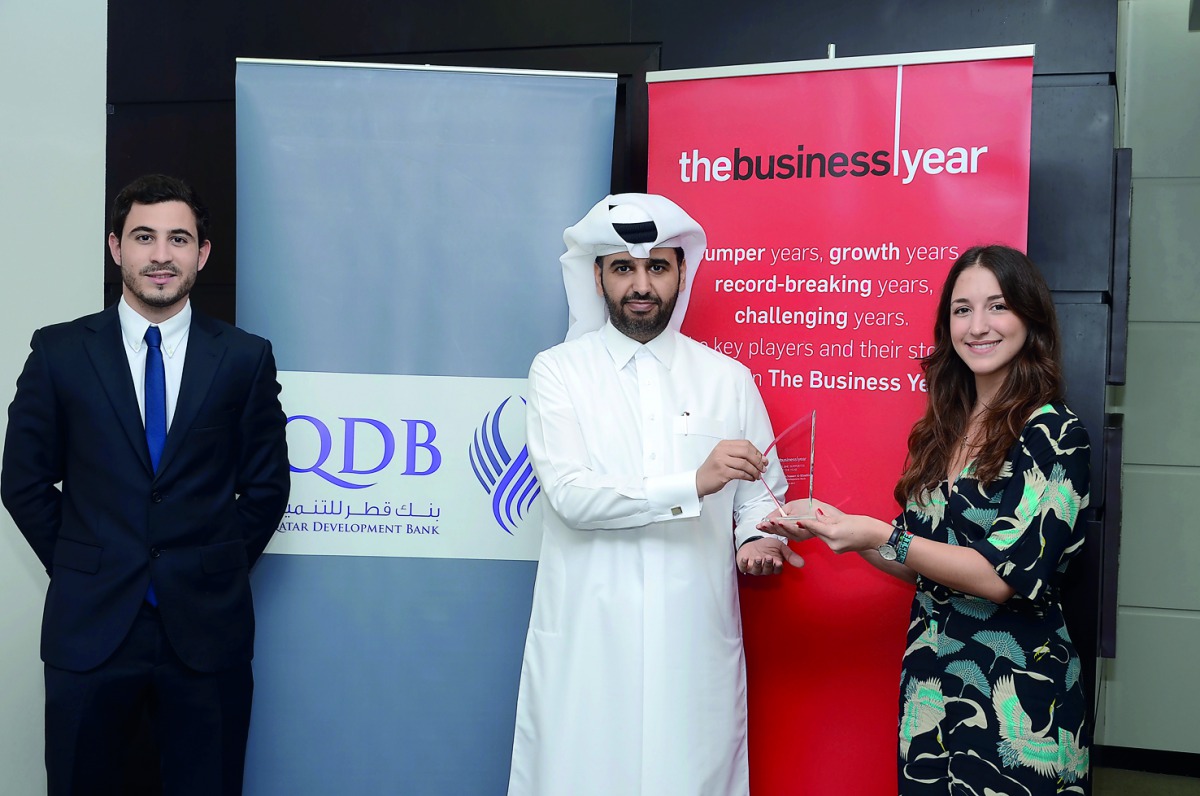 Abdulaziz bin Nasser Al Khalifa (centre), CEO of QDB receiving the award.