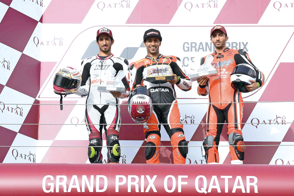 Podium winners of Qatar Superstock 600 Race 1, pose for a photograph at the Losail International Circuit yesterday.