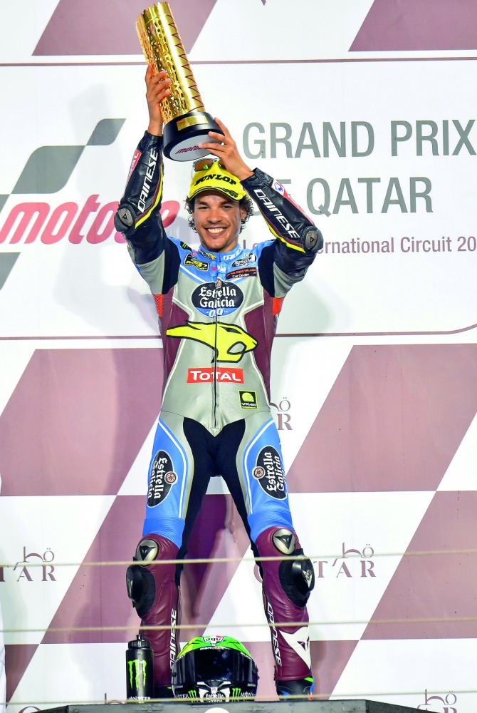 Italian Moto2 rider Franco Morbidelli celebrates on the podium after winning the Grand Prix of Qatar yesterday. Morbidelli, 22, raced to his maiden Moto2 win in a time of 40.18.480 at the Losail International Circuit.