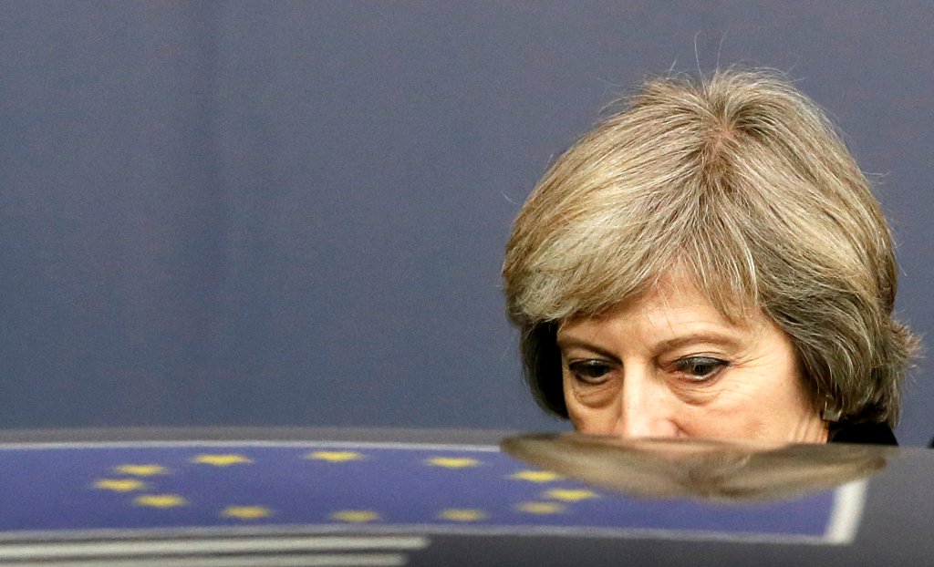 FILE PHOTO: Britain's Prime Minister Theresa May leaves a EU Summit in Brussels, Belgium December 15, 2016.  REUTERS/Yves Herman/File Photo
