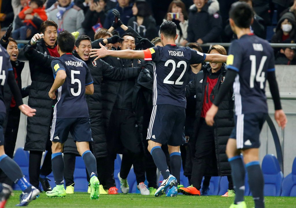 Japan's Maya Yoshida celebrates with team mates after he scored their fourth goal. REUTERS/Toru Hanai
