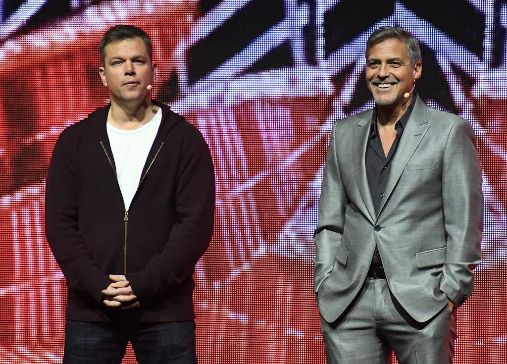 Actors Matt Damon (L) and George Clooney speak onstage at CinemaCon 2017 Paramount Pictures Presentation Highlighting Its Summer of 2017 and Beyond at The Colosseum at Caesars Palace during CinemaCon on March 28, 2017 in Las Vegas, Nevada. AFP / ANGELA WE