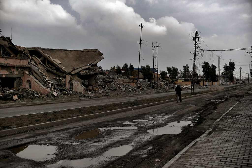 A member of the Nineveh Plain Protection Units (NPU), a small Christian militia charged with protecting the predominantly Christian Iraqi town of Qaraqosh (Hamdaniya), walks down the street in the town which lies some 30 kilometres east of the northern ci