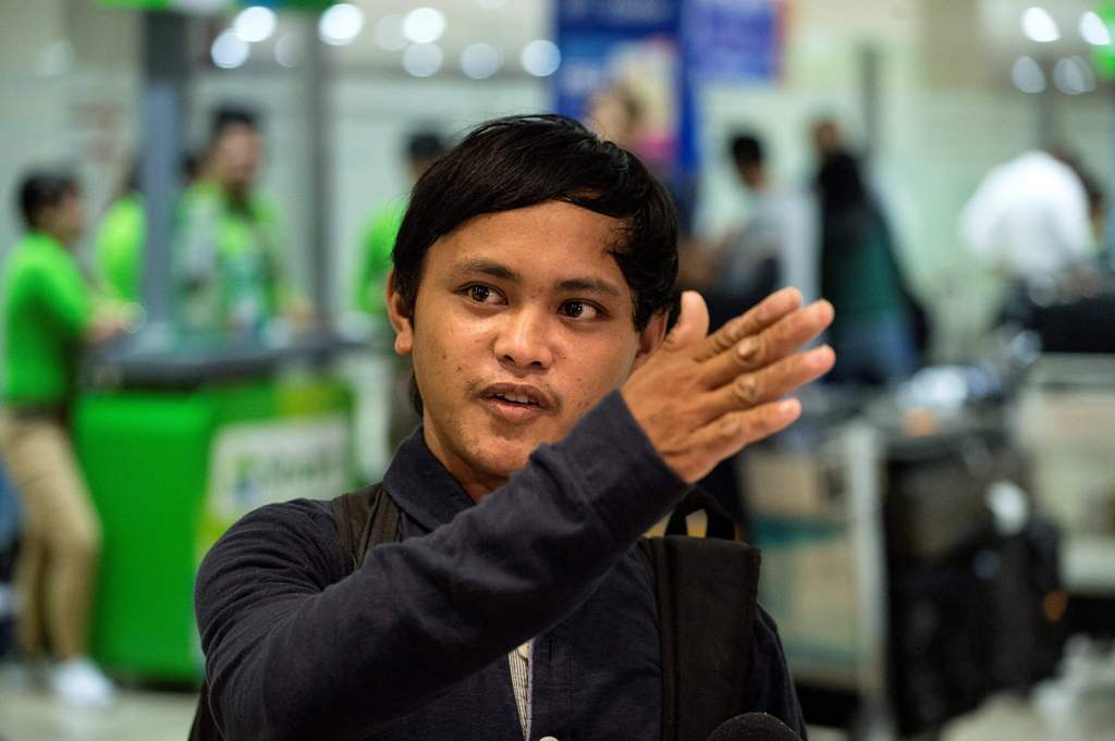 Filipino fisherman Rolando Omongos, 21, arrives at the Manila International Airport on March 29, 2017.  AFP / NOEL CELIS

