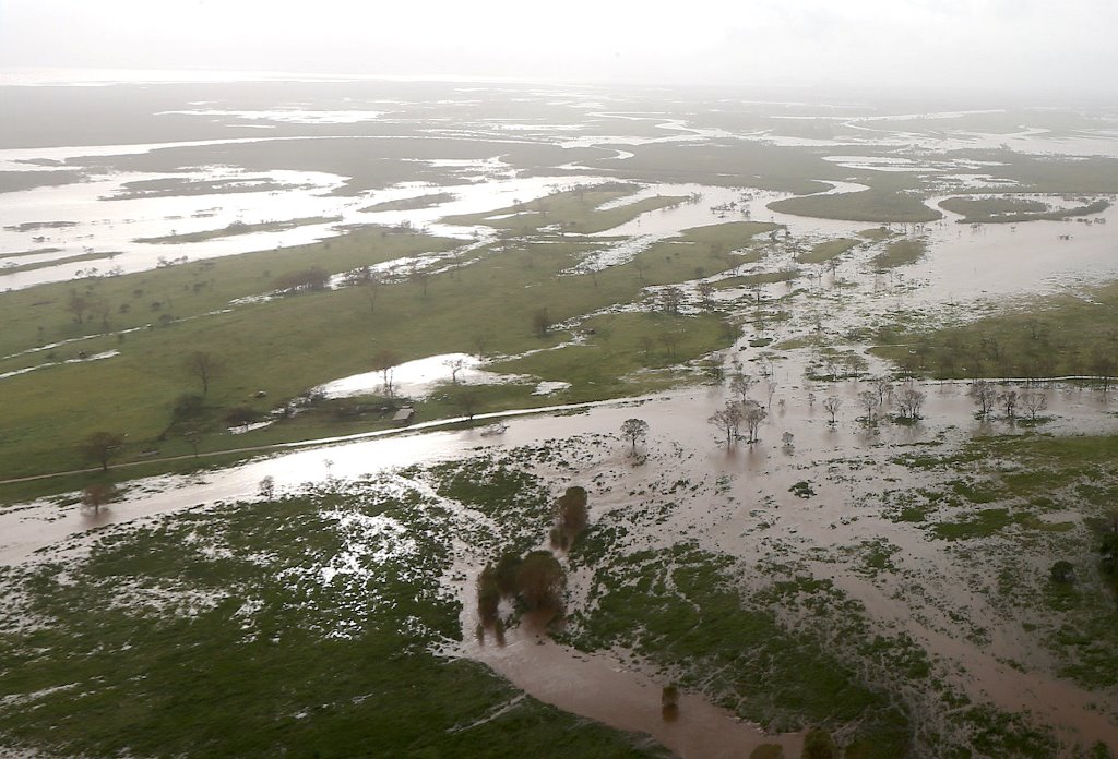 Flooded areas can be seen from an Australian Army helicopter after Cyclone Debbie passed through the area near the town of Bowen, located south of the northern Queensland town of Townsville in Australia, March 30, 2017. REUTERS/Gary Ramage/Pool
