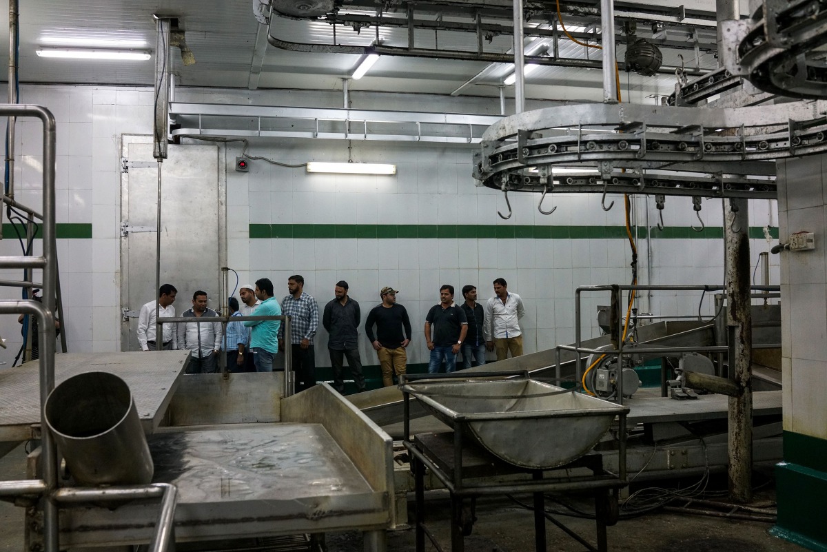 In this photograph taken on March 25, 2017, Indian workers stand inside an empty abattoir in Meerut. A zealous campaign to protect cows -- considered sacred by Hindus -- by a new right-wing government in Uttar Pradesh state has sent India's $4.8 billion b