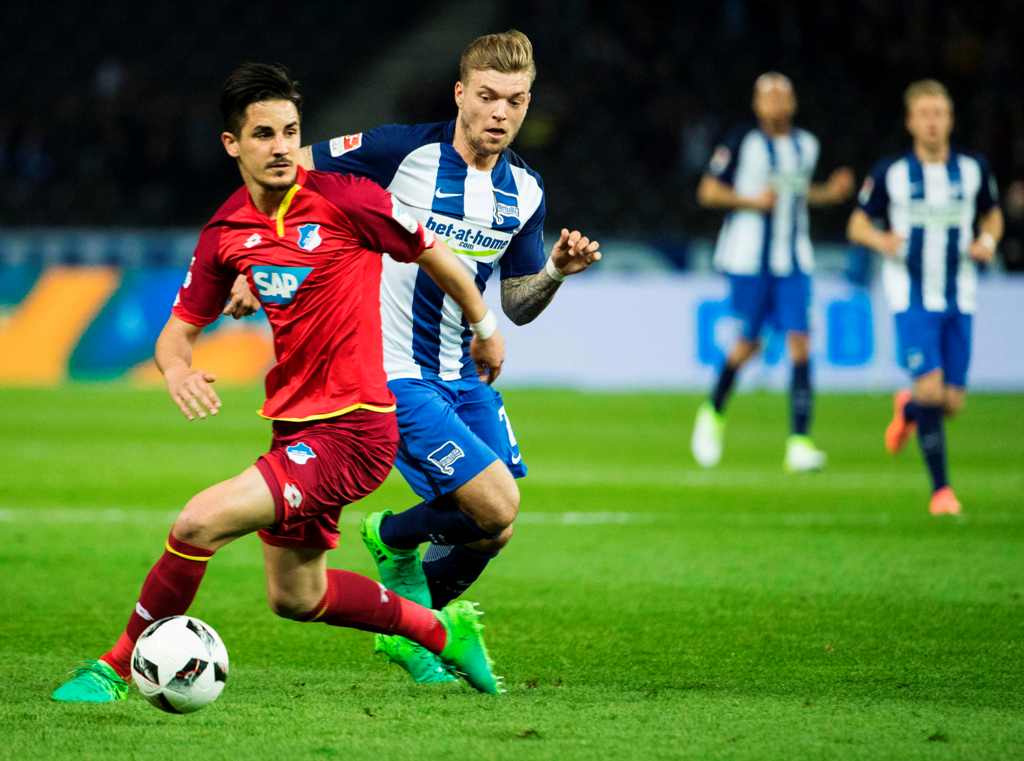 Hertha Berlin's midfielder Alexander Esswein and Hoffenheim's Croatian forward Andrej Kramaric vie for the ball during the German First division Bundesliga football match Hertha Berlin v Hoffenheim at the Olympic Stadium in Berlin, on March 31, 2017.  AFP