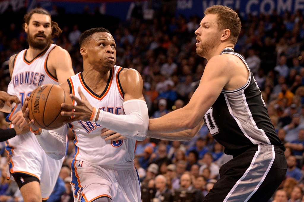Oklahoma City Thunder guard Russell Westbrook (0) drives to the basket in front of San Antonio Spurs forward David Lee (10) during the second quarter at Chesapeake Energy Arena. Mark D. Smith
