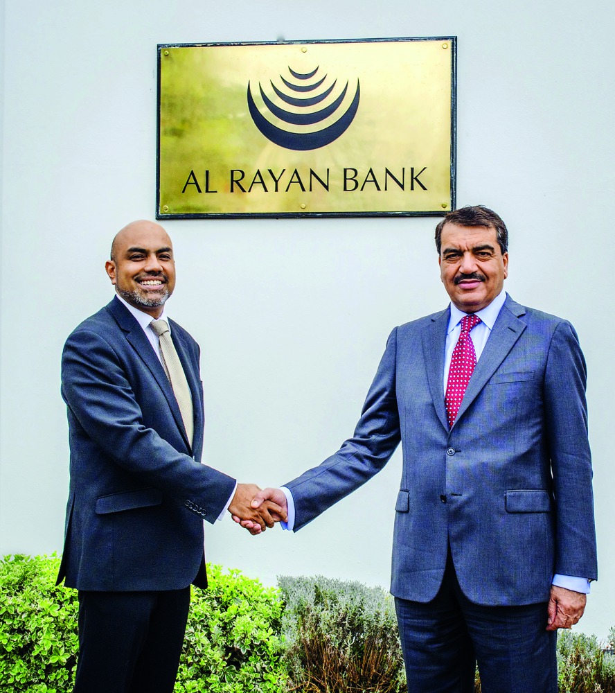Minister of Municipality and Environment, H E Mohamed bin Abdullah Al Rumaihi (right) with Sultan Choudhury, CEO of Al Rayan Bank.