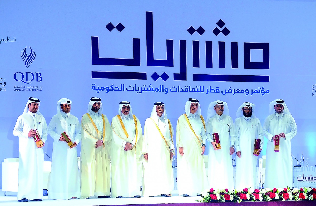 Deputy Prime Minister and Minister of State for Cabinet Affairs H E Ahmed bin Abdullah bin Zaid Al Mahmoud (centre); Minister of Finance H E Ali Shareef Al Emadi (fourth right); and  Qatar Central Bank Governor H E Sheikh Abdullah bin Saud Al Thani (fourt