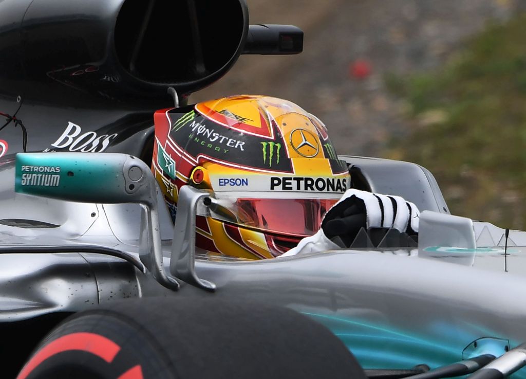 Mercedes' British driver Lewis Hamilton takes a corner during a practice session for the Formula One Chinese Grand Prix in Shanghai on April 8, 2017. / AFP / GREG BAKER
