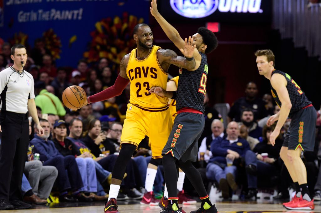 LeBron James #23 of the Cleveland Cavaliers looks for a pass while under pressure from DeAndre' Bembry #95 of the Atlanta Hawks during the second half at Quicken Loans Arena on April 7, 2017 in Cleveland, Ohio.   Jason Miller/Getty Images/AFP
