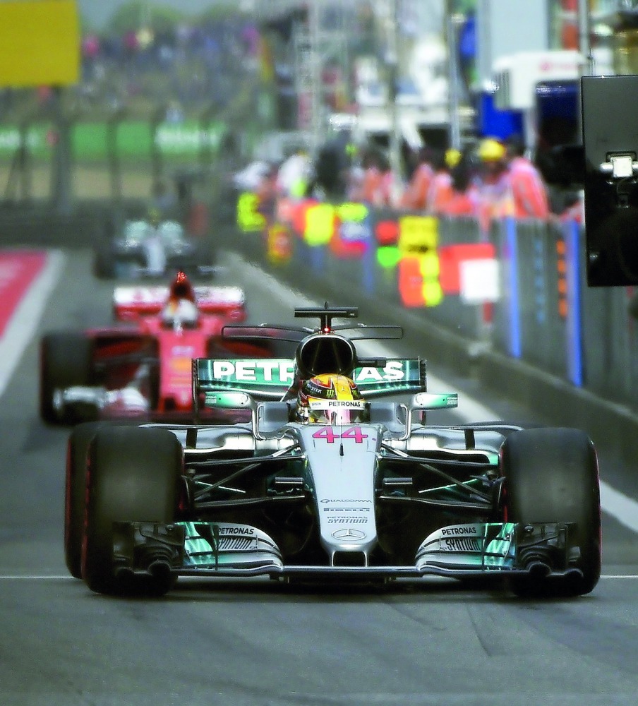 Mercedes' British driver Lewis Hamilton drives out of the pits during the qualifying session for the Formula One Chinese Grand Prix in Shanghai. 
