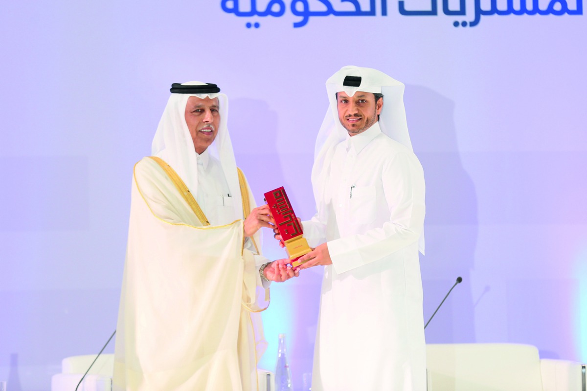 Deputy Prime Minister and Minister of State for Cabinet Affairs H E Ahmed bin Abdullah bin Zaid Al Mahmoud (left) presents the Moushtarayat National Award to Abdullah Fadhalah Al-Sulaiti, Managing Director of Nakilat during the event.