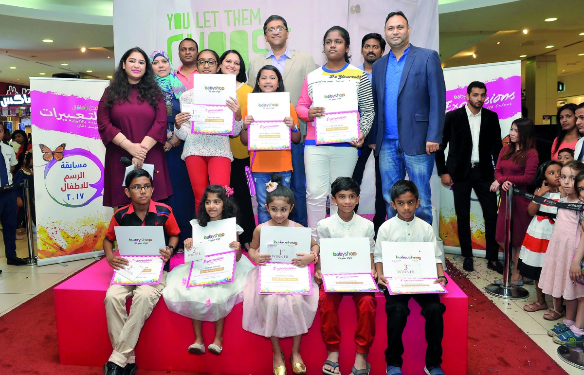 Santosh Pai, (fourth right), COO Landmark Group; Qatar, Rajgopal, (third left), Marketing Manager Landmark Group; and other officials with winners of Baby shop drawing competition ‘Expressions’ at Centerpoint Alasmakh Mall, yesterday. 
Pic Kammutty VP / 