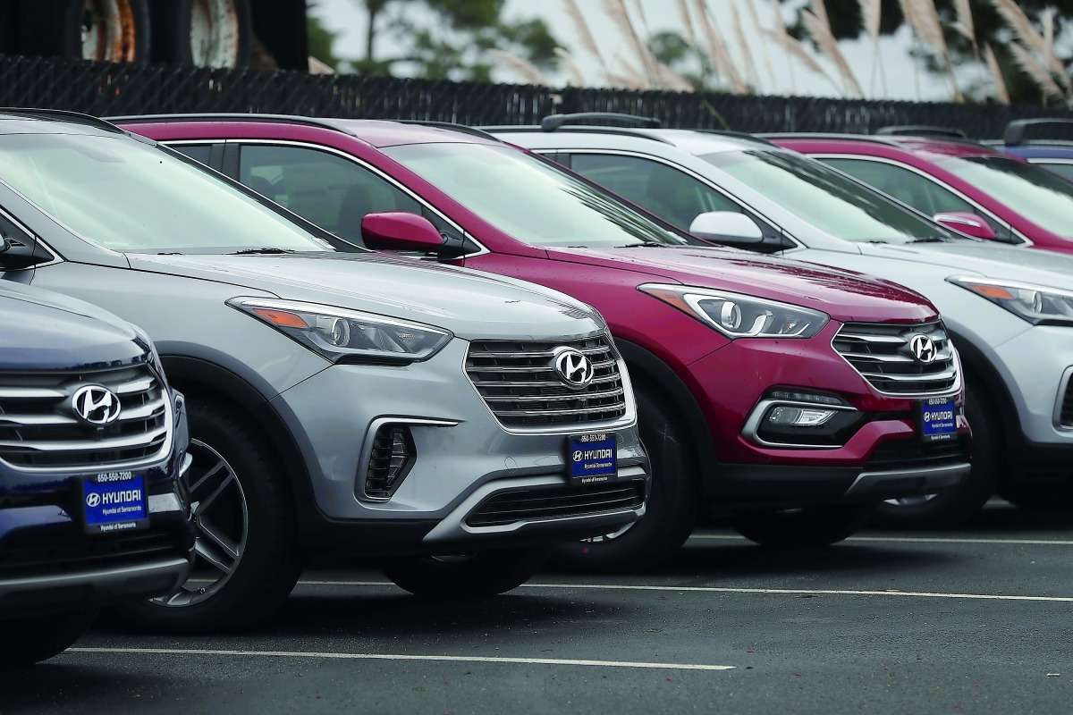 Brand new Hyundai Santa Fe SUVs are displayed at a Hyundai dealership on April 7, 2017 in Colma, California. South Korean automakers Kia and Hyundai announced that they are recalling 1.4 million cars and SUVs in the U.S., Canada and South Korea for a pote