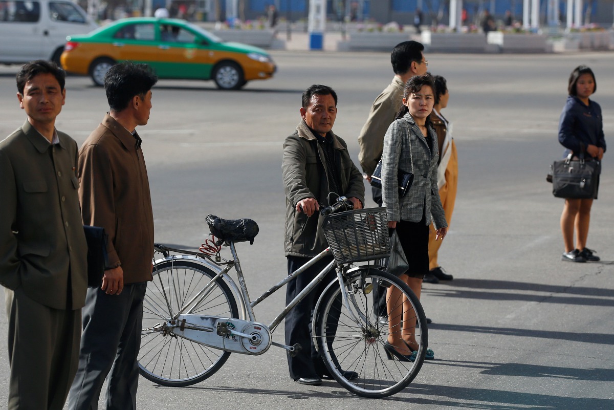 People cross the street in central Pyongyang, North Korea April 12, 2017. REUTERS/Damir Sagolj