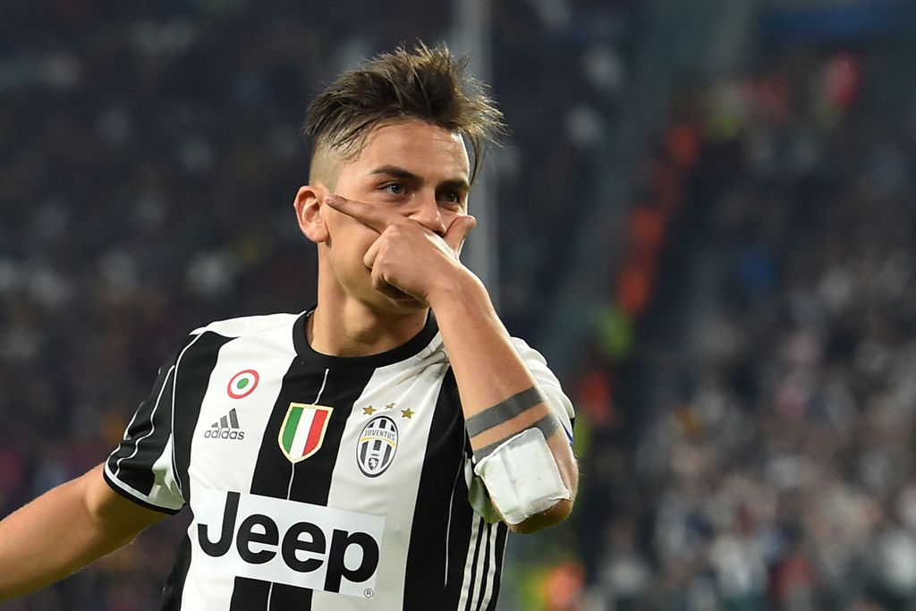 (FILES) This file photo taken on April 11, 2017 shows Juventus' forward from Argentina Paulo Dybala celebrating after scoring during the UEFA Champions League quarter final first leg football match Juventus vs Barcelona, on April 11, 2017 at the Juventus 