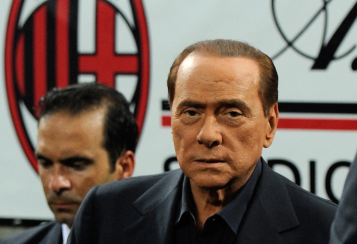 (FILES) This file photo taken on August 21, 2011 shows Italian President of Council Silvio Berlusconi steping on the pitch after AC MIlan won the Trophee Luigi Berlusconi match AC Milan against Juventus, 2-1, on August 21, 2011, in San Siro stadium in Mil