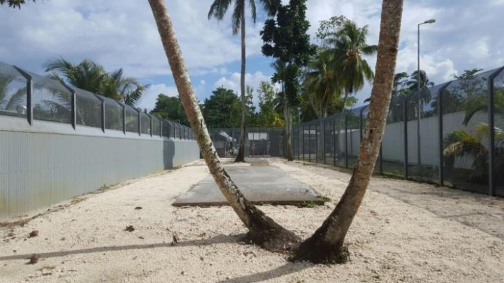 File Photo: Security fences can be seen near trees inside the Manus Island detention centre in Papua New Guinea, February 11, 2017. Behrouz Boochani/Handout via REUTERS/File Photo