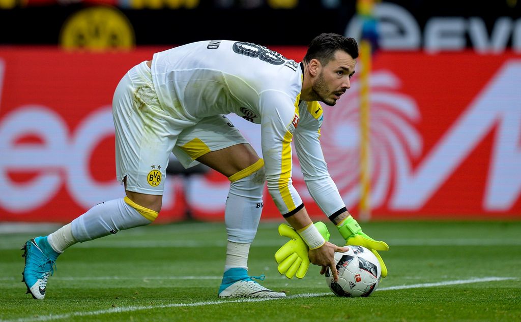 Dortmund's Swiss goalkeeper Roman Buerki plays the ball during the German First division Bundesliga football match between Borussia Dortmund and Eintracht Frankfurt in Dortmund, western Germany, on April 15, 2017.  AFP / SASCHA SCHUERMANN