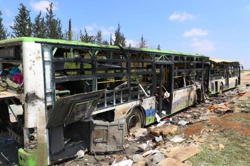 Damaged buses are seen after an explosion yesterday at insurgent-held al-Rashideen, Aleppo province, Syria April 16, 2017. REUTERS/Ammar Abdullah.