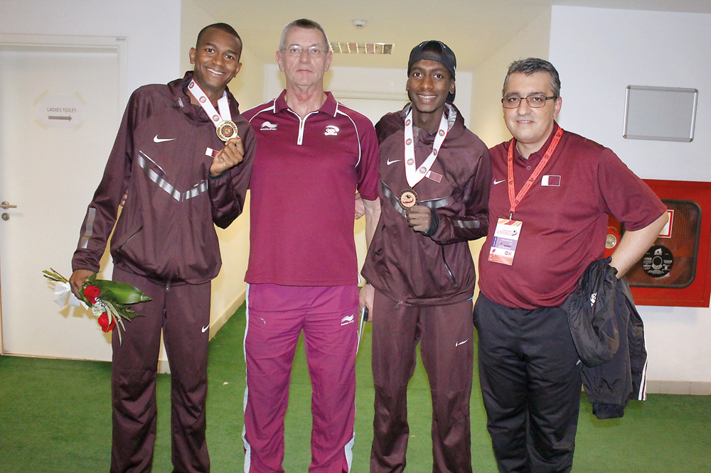 Joachim Krug (second left) is seen with Qatar’s top athlete Mutaz Barshim in this file photo. A resident of Qatar for more than 35 years, Krug has taken an active part in Qatar’s rise as a sports hub.