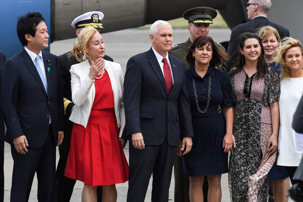 US Vice President Mike Pence (C), his wife Karen (centre R) and two daughters Audrey (2nd R) and Charlotte (R) pose for photographs after arriving at the US naval air facility in Atsugi, Kanagawa prefecture on April 18, 2017. AFP / Toshifumi Kitamura