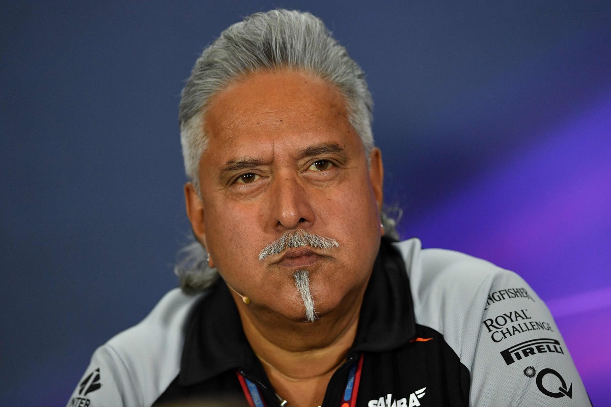 This file photo taken on July 8, 2016 shows Sahara Force India F1 team principal Vijay Mallya speaking during a press conference following the second practice session at Silverstone motor racing circuit in Silverstone, central England. AFP / Andrej Isakov