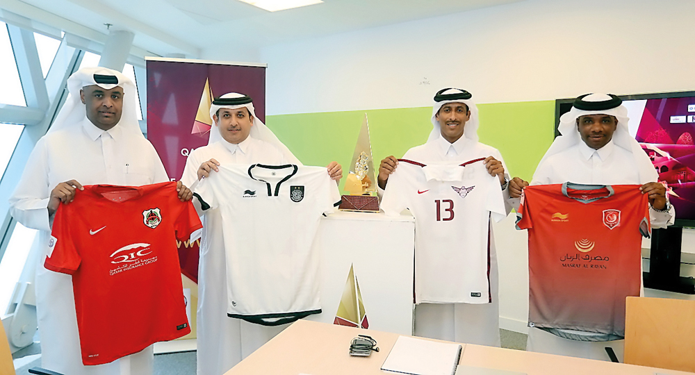 Representatives of Lekhwiya, Al Sadd, Al Rayyan and El Jaish  showing the jerseys their sides would be wearing ahead of the Qatar Cup semi-finals.
