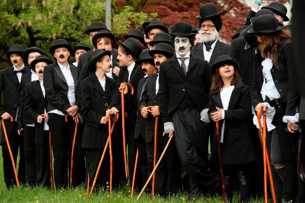 Some 662 people dressed as 'The Tramp' pose for a group picture to mark the first anniversary of Chaplin's World By Grevin, and Charlie Chaplin's birthday, as the museum plans to set the record for the world's largest gathering of people dressed as The Tr
