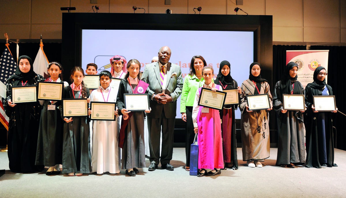 Dana Shell Smith, US Ambassador to Qatar, and Akel I Kahera, Dean of VCUQatar, with the winners of Third Annual Young Writers Competition yesterday. Pic: Abdul Basit / The Peninsula