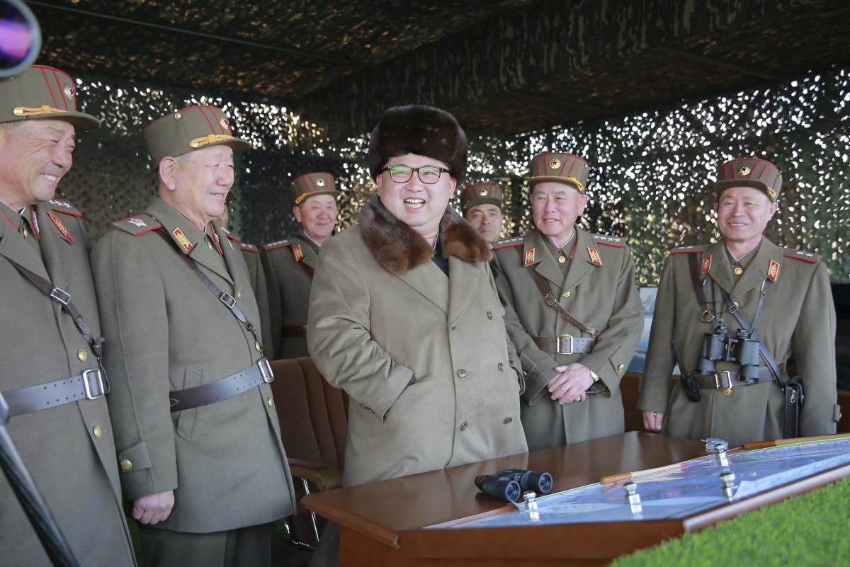 North Korean Kim Jong Un with military officers as he observes a drill photo by Korean Central News Agency KCNA on March 25, 2016 (REUTERS) 