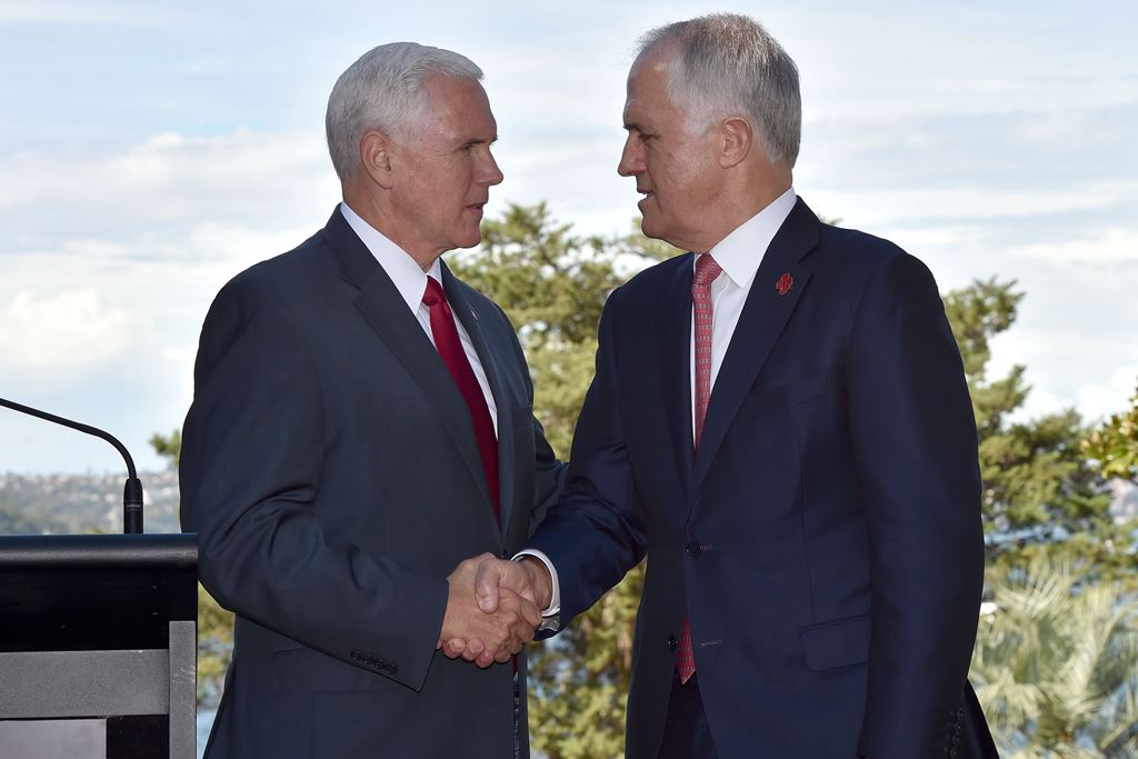 US Vice President Mike Pence (L) shakes hand with Australia's Prime Minister Malcolm Turnbull as they arrive for a joint press conference at the Kirribilli House Sydney on April 22, 2017. AFP / Saeed KHAN
