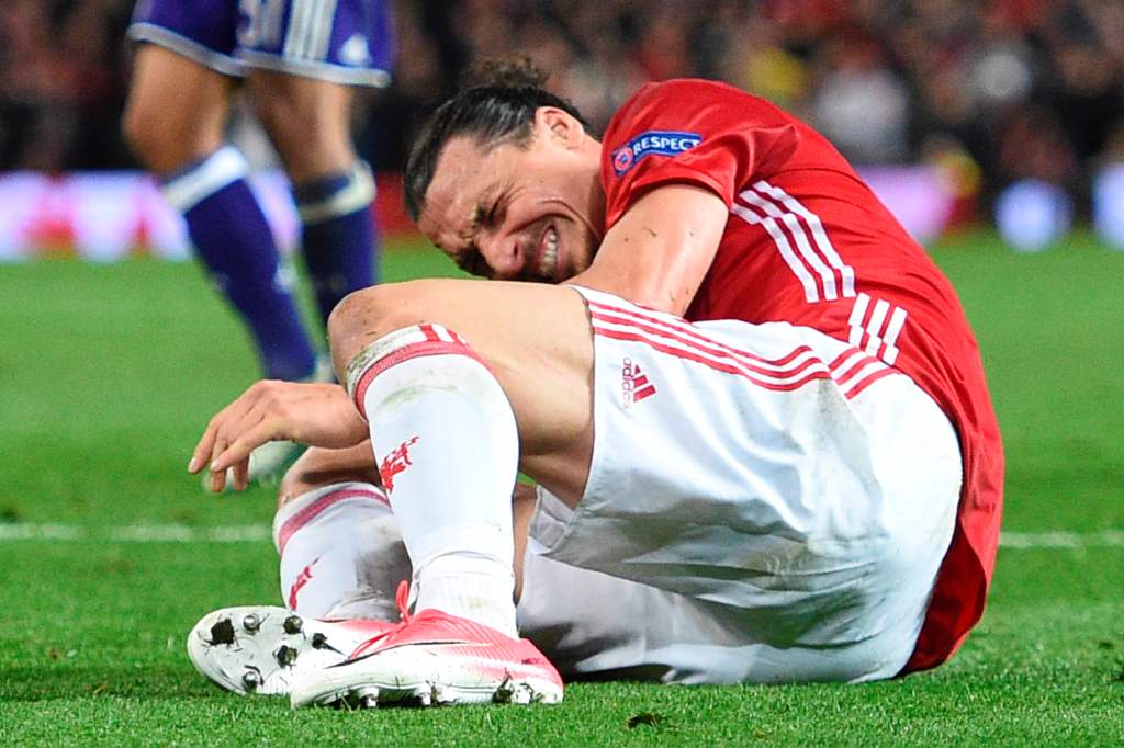 Manchester United's Swedish striker Zlatan Ibrahimovic reacts after falling awkwardly during the UEFA Europa League quarter-final second leg football match between Manchester United and Anderlecht at Old Trafford in Manchester, north west England, on Apri